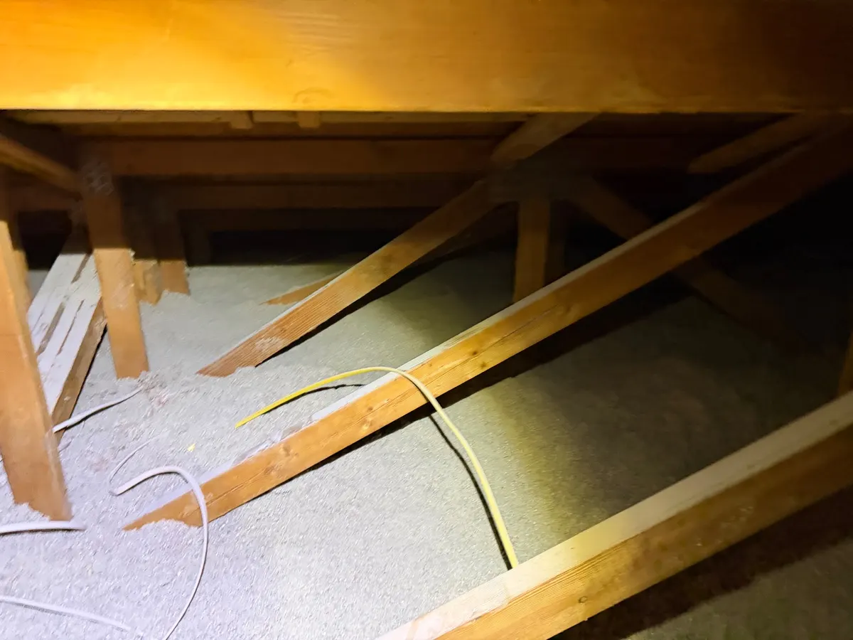 Before attic condition from Millcreek before-and-after photo set 2