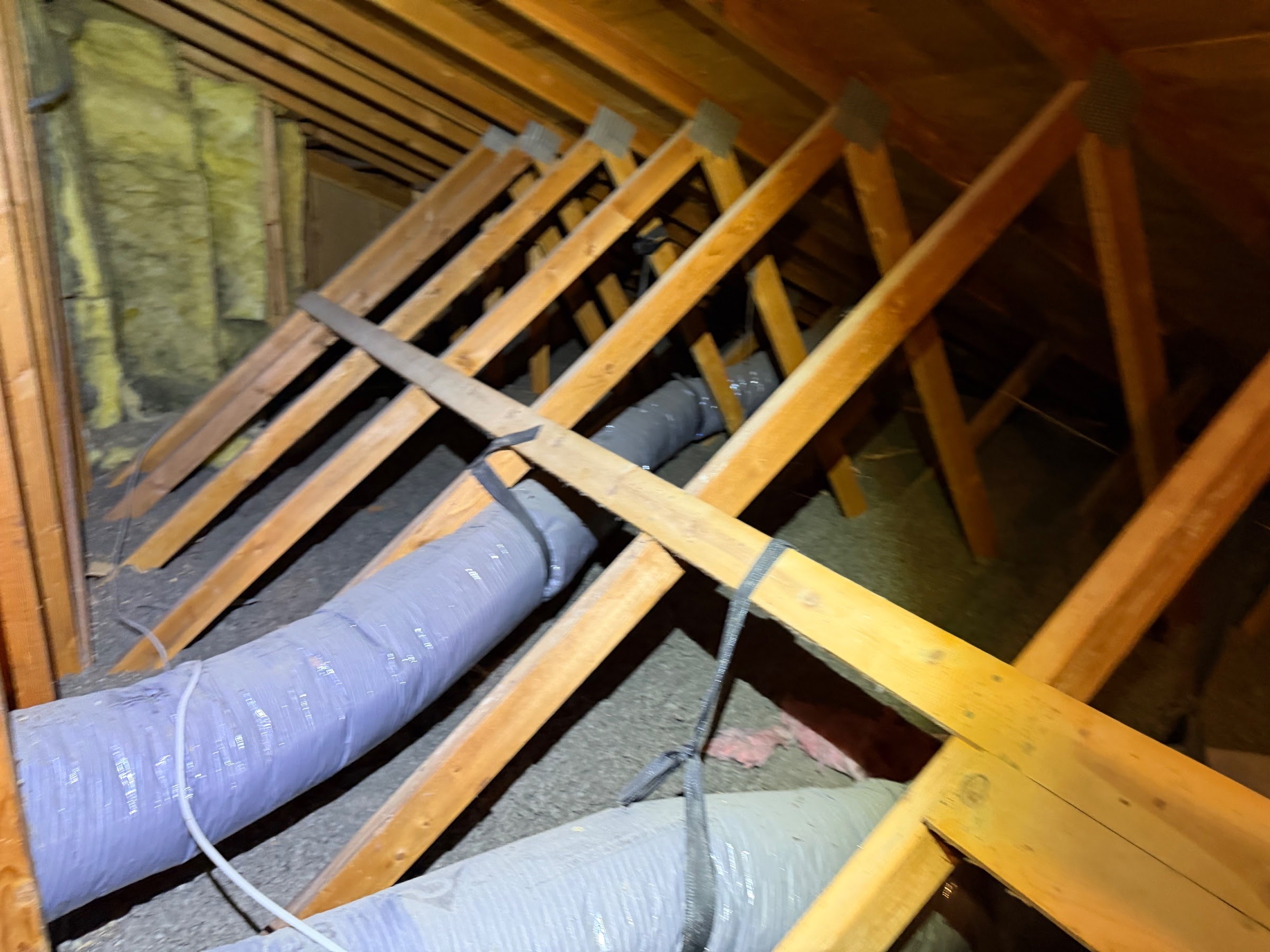 Before attic condition from Millcreek before-and-after photo set 3